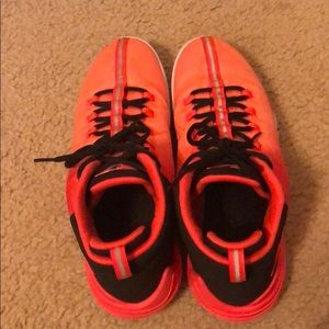 Bright red/orange basketball shoes (Jordans)